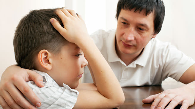 dad consoling son
