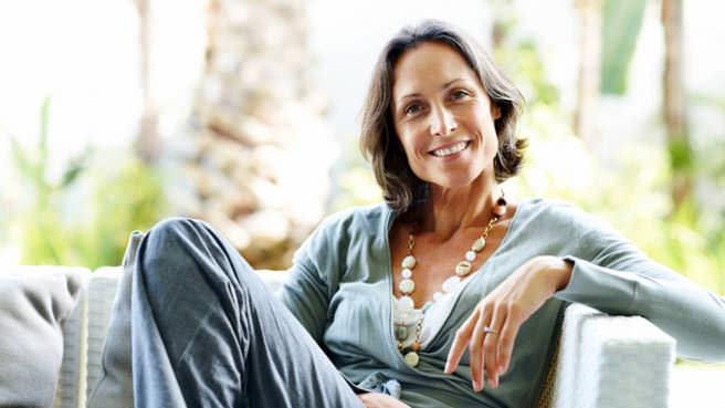 woman sitting on couch