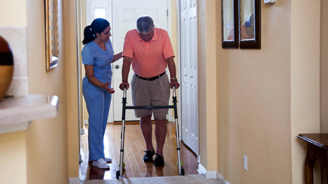 senior with nurse in emergency room